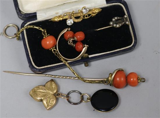 A 9ct gold bar brooch and four other items including a coral pin and locket